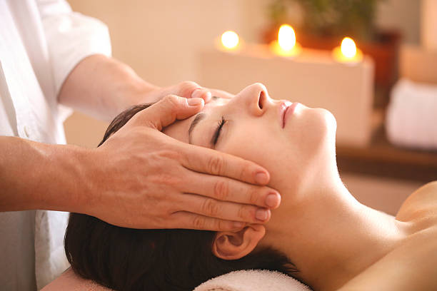 istock Young woman having a head massage 636967354