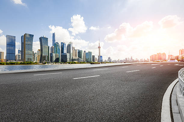 istock Asphalt road and modern skyline and buildings in Shanghai 636967524