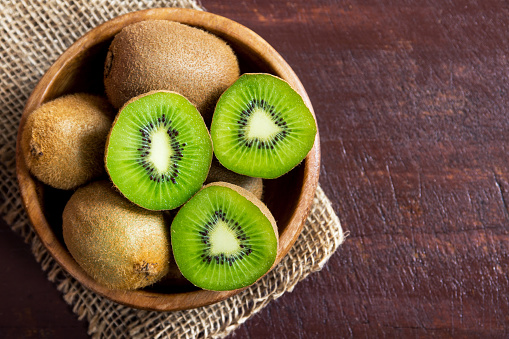 kiwi fruit on wooden table