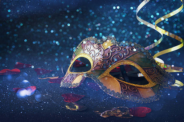 istock elegant venetian, mardi gras mask on glitter background 636969306