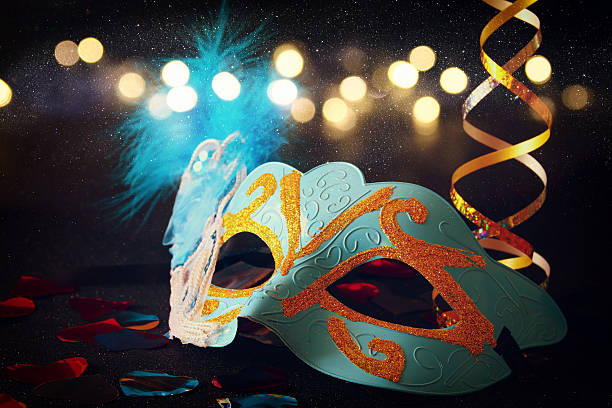 istock elegant venetian, mardi gras mask on glitter background 636969628