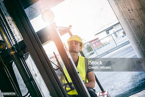 Fork Lift Truck Driver Lifting Pallet In Storage Stock Photo - Download Image Now - Forklift, Truck, Warehouse