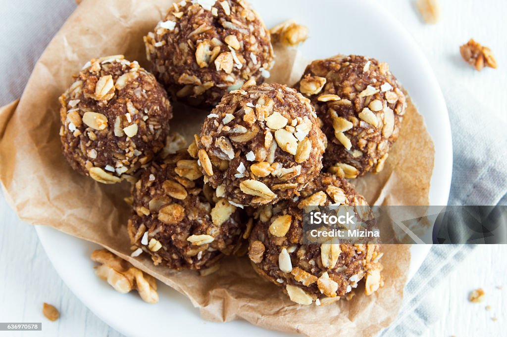 energy granola bites Healthy organic energy granola bites with nuts, cacao, banana and honey - vegan vegetarian raw snack or meal Granola Stock Photo