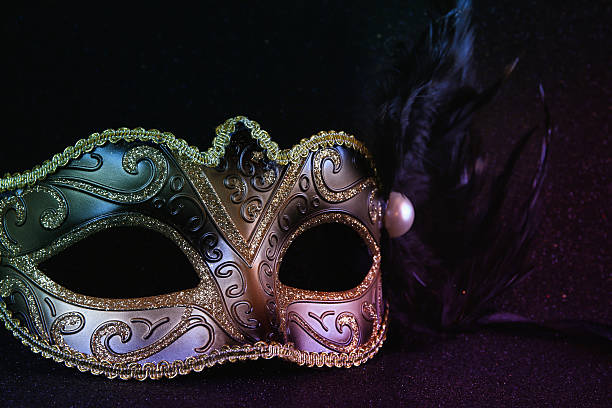 istock black venetian mask on glitter background 636970656