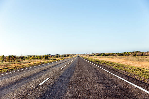 istock Paved road in the steppe 636971360