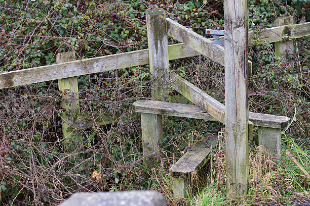 istock Old wooden stile by canal towpath Swindon Wiltshire 636971718