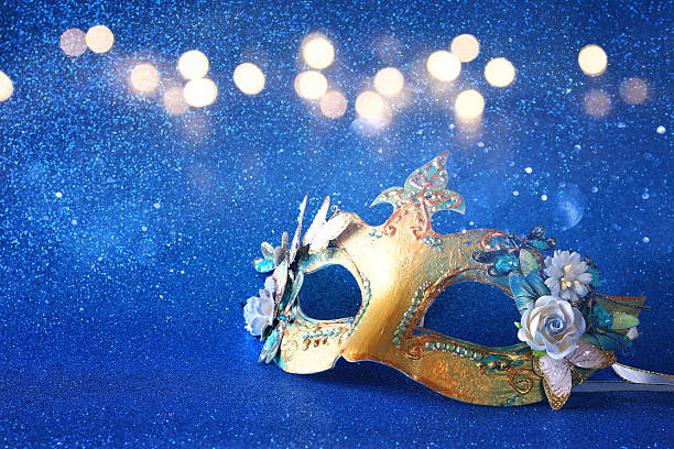 istock elegant venetian mask on blue glitter background 636971724