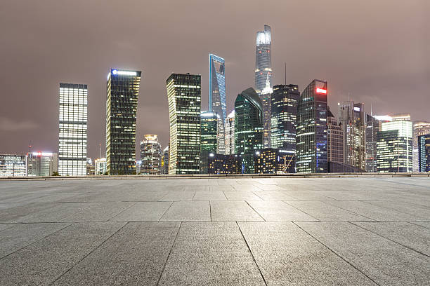 istock Empty floor with modern cityscape at night in Shanghai 636971840