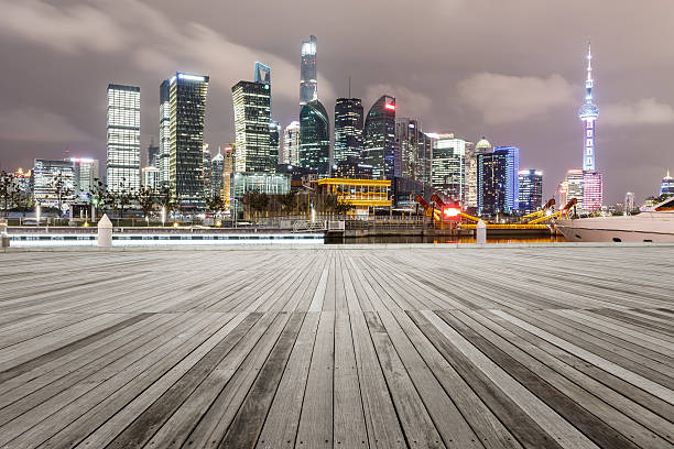 istock Empty floor with modern cityscape at night in Shanghai 636972294