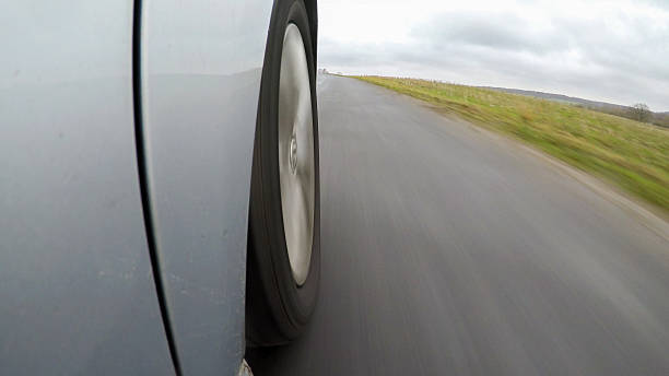 istock car driving on a  asphalt  road with motion blurr 636973658