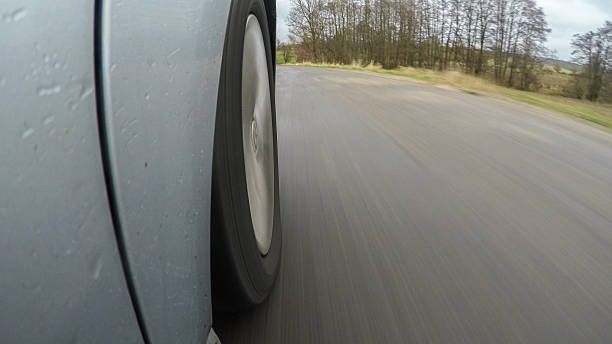 istock car driving on a  asphalt  road with motion blurr 636974186