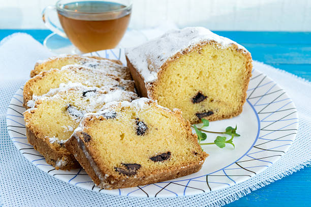 istock Freshly baked homemade cakes, decorating the top with powdered 636975036
