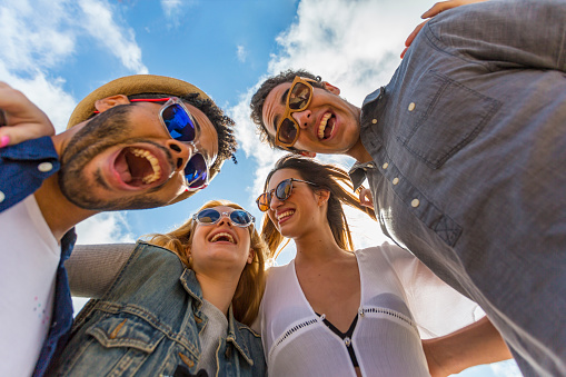 POV style selfie self portrait of young people partying on a Barcelona beach in Spain