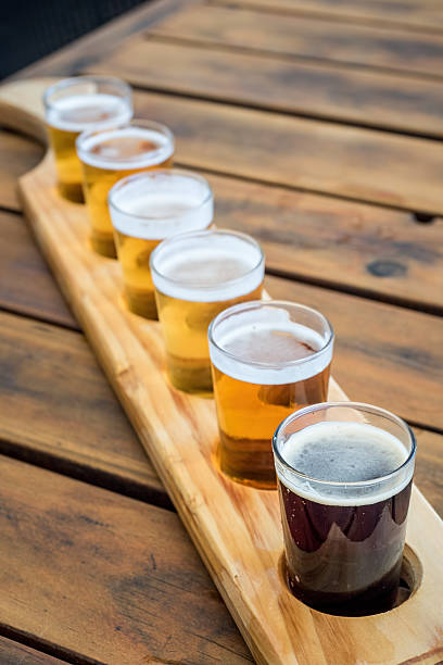 istock Beer samplers in unique wooden tray 636976736