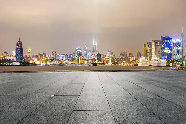 istock Empty floor with modern cityscape at night in Shanghai 636978490