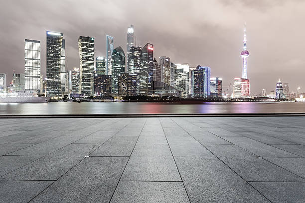 istock Empty floor with modern cityscape at night in Shanghai 636978696