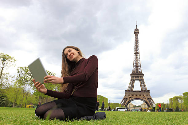 istock Young beautiful woman taking selfies in Paris 636978812