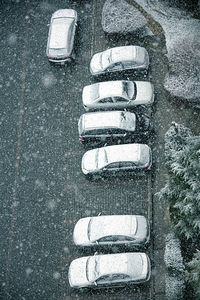 istock snow covered cars 636979090