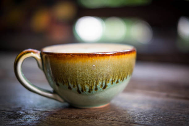 istock Coffee cup on wooden desk 636979418