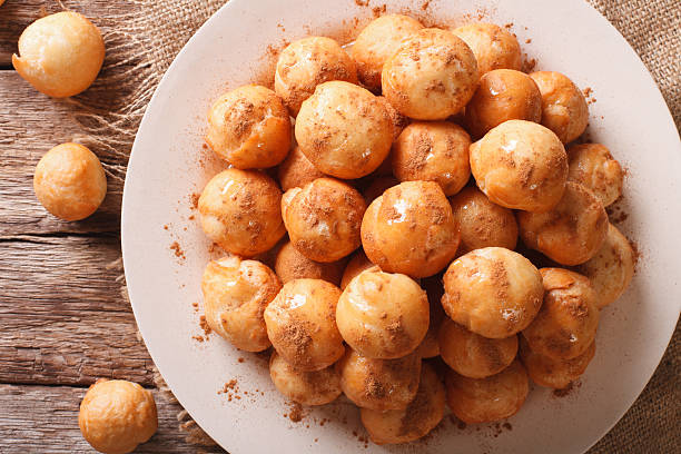 istock Greek loukoumades donuts with honey and cinnamon closeup 636981834
