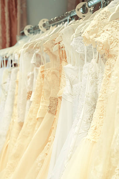 istock White and cream-colored wedding dresses vertical 636982328
