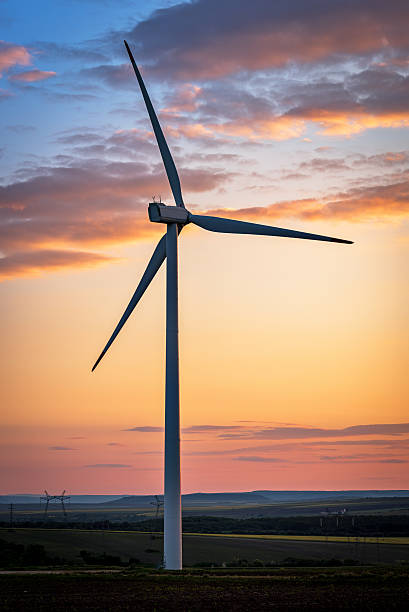 Beautiful sunset above the windmills on the field. Beautiful sunset above the windmills on the field. landscape alternative energy scenics farm stock pictures, royalty-free photos & images