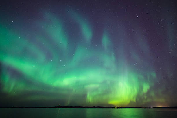 istock Northern lights over lake in finland 636985740