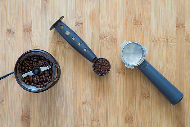 istock Coffee grounds in a scoop with coffee grinder 636991326