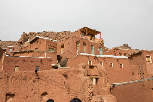 The tipical red mud-brick houses in the ancient village of Abyaneh, near Kashan, in Iran