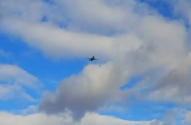 airplane flying through dark stormy clouds aircraft flying through storm clouds