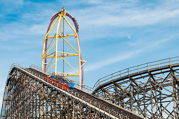 Roller coaster rides at an amusement park stock photo
