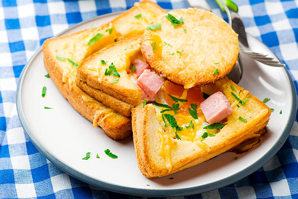 istock Ham and Cheese Baked Eggs in Toast. for a breakfast 636993108