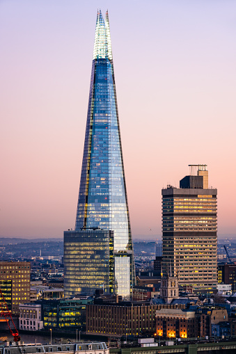 The Shard skyscraper in London at dusk. The tallest skyscraper in the Europe with height of 310 m, designed by architect Renzo Piano.