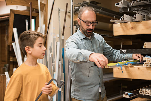istock Father and son carpenters 636997510