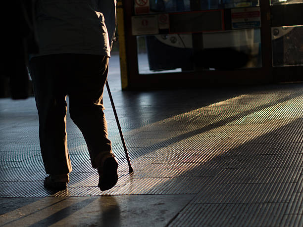 istock Silhouette of Man with Walking stick 636998612