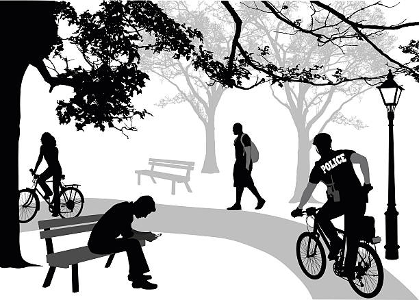 polizei rad im park - focus on shadow women bicycle outdoors stock-grafiken, -clipart, -cartoons und -symbole