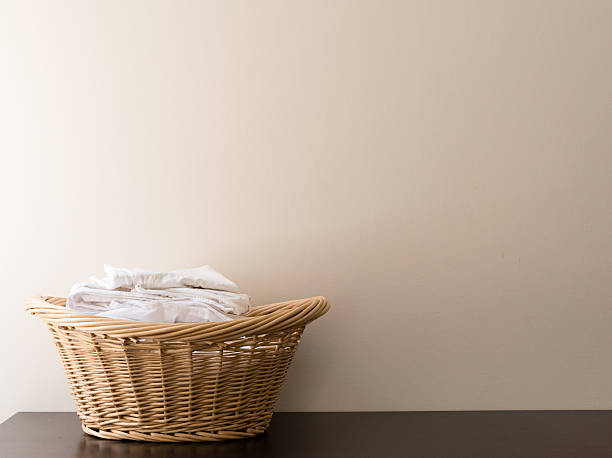 istock Wicker laundry basket with white washing 637000852