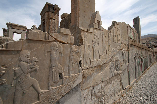 istock Cracked stone wall with carving at Persepolis 637001470