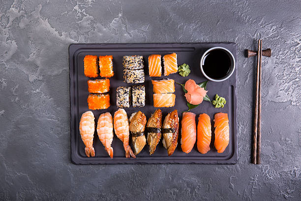 istock Sushi Set gunkan, nigiri and rolls close up 637002232