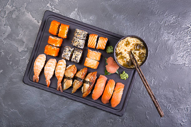 istock Sushi Set gunkan, nigiri and rolls close up 637002330