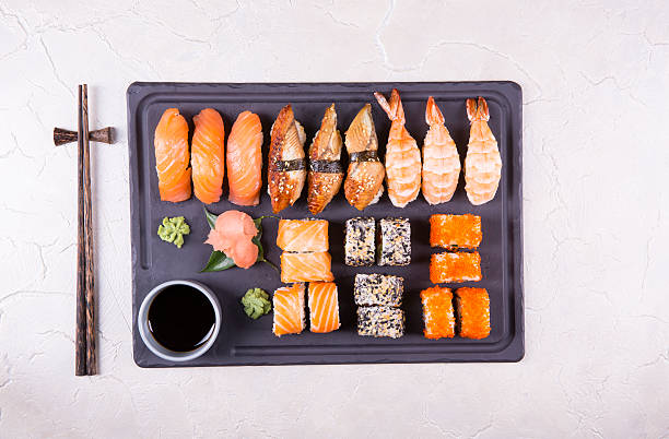 istock Sushi Set gunkan, nigiri and rolls close up 637002432