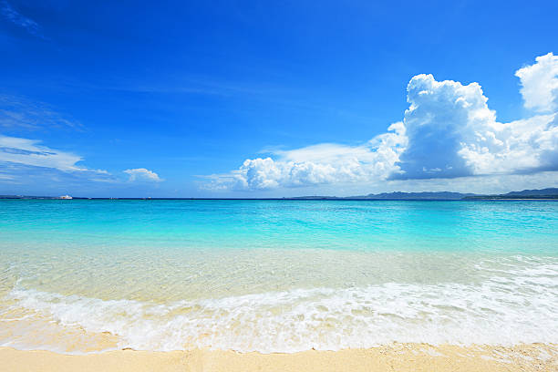 Summertime at the beach Picture of a beautiful beach in Okinawa cumulonimbus stock pictures, royalty-free photos & images