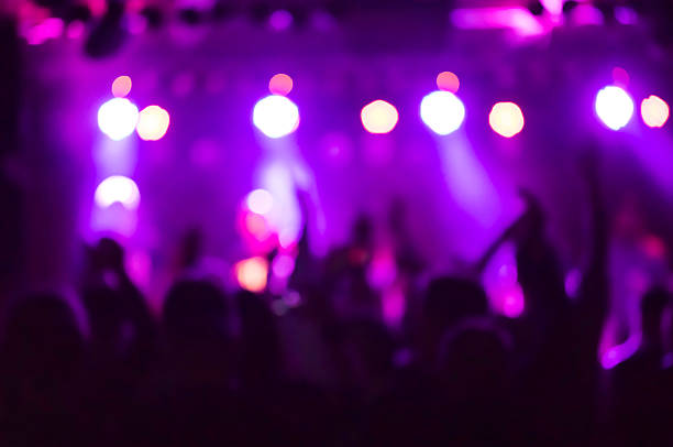 istock defocused colorful stage lights during music concert 637008604