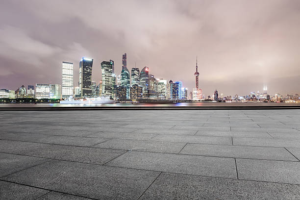 istock Empty floor with modern cityscape at night in Shanghai 637009100