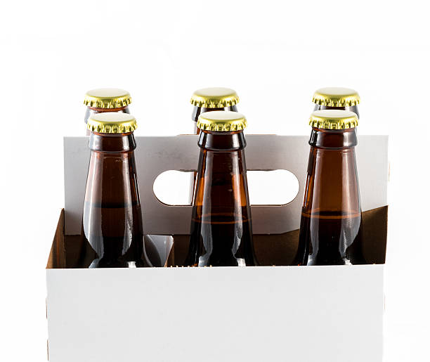 istock Six bottles of beer in cardboard carrier 637012402