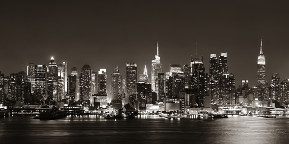 Midtown Manhattan skyline in black and white at dusk panorama over Hudson River