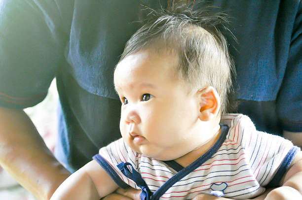 istock baby or a boy with his mom 637014356