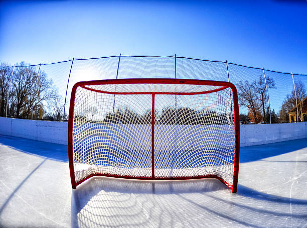Outdoor Hockey Goal on Hockey Rink - Wide Angle Outdoor Hockey Goal on Hockey Rink - Wide Angle ice hockey net stock pictures, royalty-free photos & images