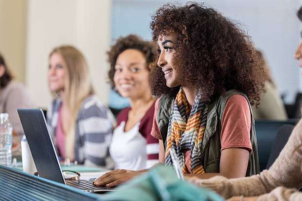istock Attentive African American college student takes notes during lecture 637015082