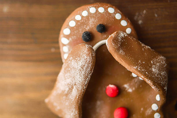 istock Sad little gingerbread man covering his face 637018174